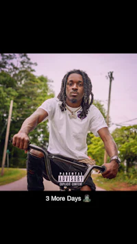a man with dreadlocks riding a bike